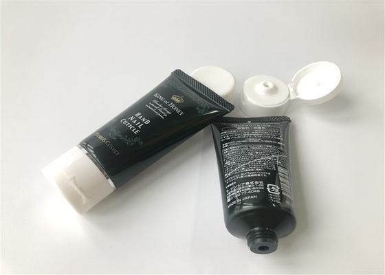 Black and green colored bead tube Hand Nail Cuticle 2 color screen printing hot stamping gold band Flip top cap 50g